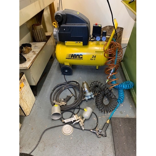 128 - AN ABAC AIR COMPRESSOR, 24 litre capacity 2Hp motor with various accessories and pipes