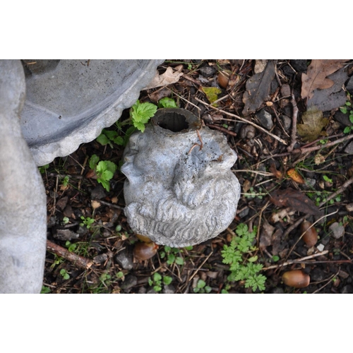 1002 - A VINTAGE LEAD BIRD BATH in the form of a child standing on a scalloped footed platter (head detache... 