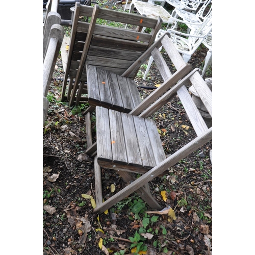 1003 - A PAIR OF HARDWOOD GARDEN CHAIRS (seat width 48cm between arms) and four folding pine garden chairs ... 