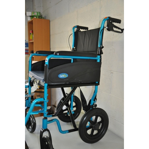 1106 - A CARE CO MODERN WHEELCHAIR in metallic turquoise finish with two foot rests and padded seat pad