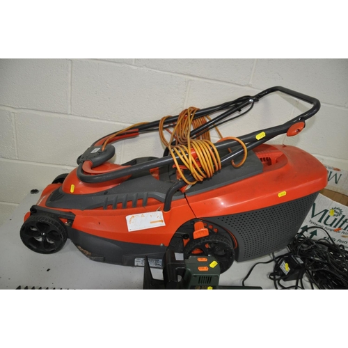 1131 - A FLYMO C34C ELECTRIC LAWN MOWER with grass box, three garden rock lights with power supply (both PA... 