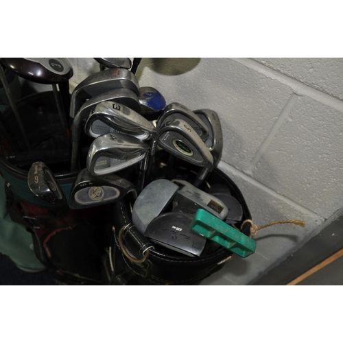 1136 - THREE GOLF BAGS CONTAINING CLUBS, including Pinseeker, Dunlop, Sakauri, Donnay etc