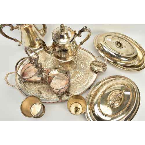 116 - A QUANTITY OF METALWARE, to include items such as a large silver plated oval footed foliate embossed... 