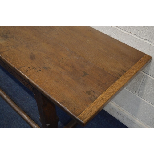 1206 - A 17TH CENTURY AND LATER OAK SERVING TABLE, double plank top, carved lunettes to frieze, on a jointe... 