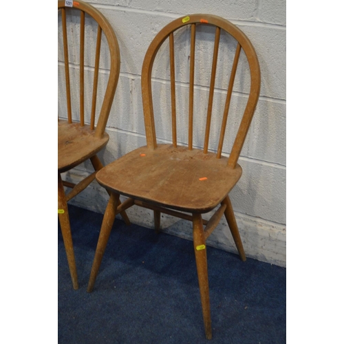 1221 - A SET OF THREE DISTRESSED ERCOL BLOND ELM AND BEECH HOOP SPINDLE BACK CHAIRS