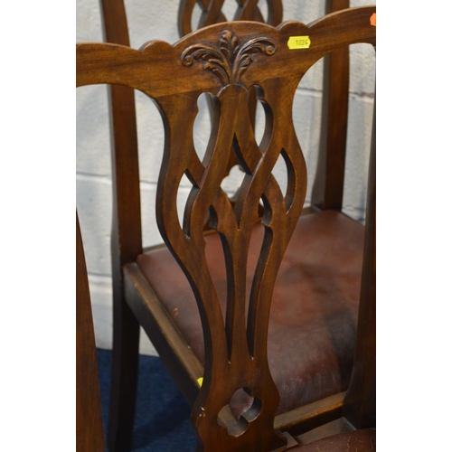 1224 - AN EARLY TO MID TWENTIETH CENTURY OAK DRAW LEAF TABLE, on acorn legs united by a cross stretcher, ex... 