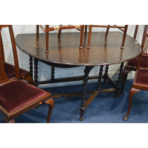 1225 - AN EARLY TO MID TWENTIETH CENTURY OAK BARLEY TWIST GATE LEG TABLE, width 138cm x open depth 135cm x ... 