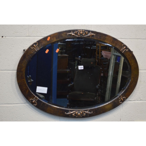 1229 - AN ARTS AND CRAFTS BEATON COPPER FRAMED OVAL BEVELLED EDGE WALL MIRROR, together with an Edwardian m... 