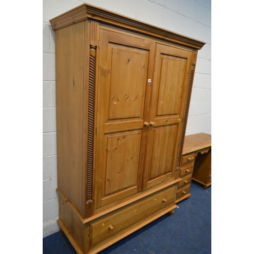 1236 - A PINE DOUBLE DOOR WARDROBE, flanked with barley twist rope detail, above a single long drawer, widt... 