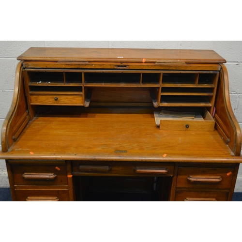 1244 - AN EARLY TO MID 20TH CENTURY GOLDEN OAK ROLL TOP DESK, fitted interior (one drawer dismantled) above... 