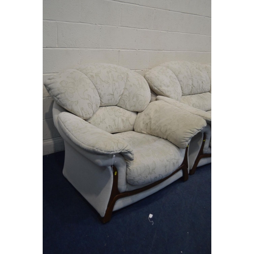 1249 - A CREAM UPHOLSTERED FOUR PIECE LOUNGE SUITE, comprising a two seater settee, pair of armchairs and a... 