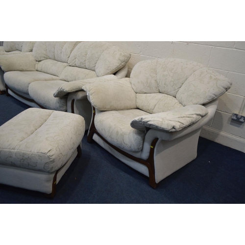 1249 - A CREAM UPHOLSTERED FOUR PIECE LOUNGE SUITE, comprising a two seater settee, pair of armchairs and a... 