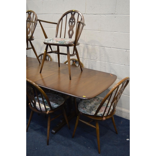 1257 - A ERCOL (GOLDEN DAWN) DINING SUITE, comprising an extending table, with a single fold out leaf, exte... 