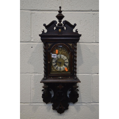 1267 - AN EARLY TO MID TWENTHIETH CENTURY OAK WALL CLOCK, with a brass and enamelled dial, height 75cm (no ... 