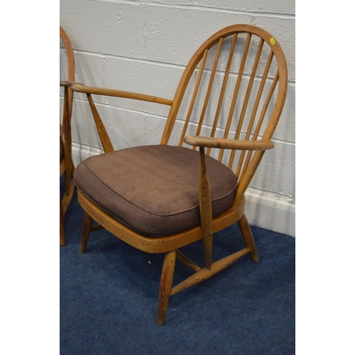 1280 - A PAIR OF ERCOL WINDOR MODEL 334E BEECH EAST ARMCHAIRS, the hoop back with spindles, spring seat and... 