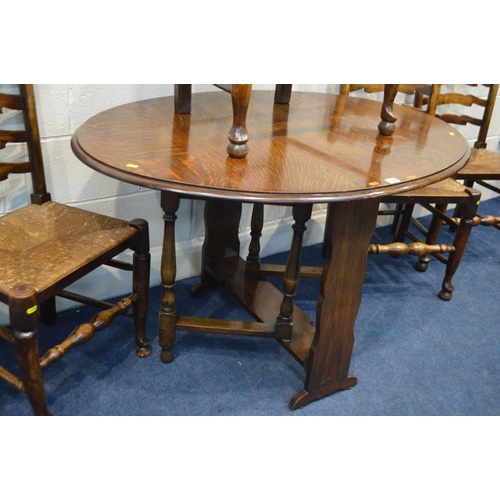 1294 - AN EARLY TO MID 20TH CENTURY OAK OVAL TOPPED GATE LEG TABLE, together with a set of five rush seated... 