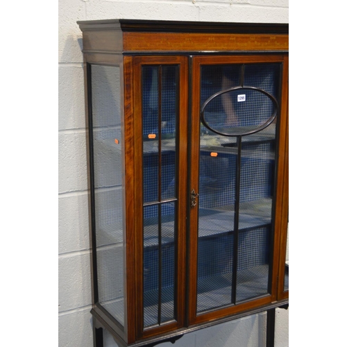 1295 - AN EDWARDIAN MAHOGANY INLAID AND STRUNG DISPLAY CABINET, with a single central door enclosing two fi... 