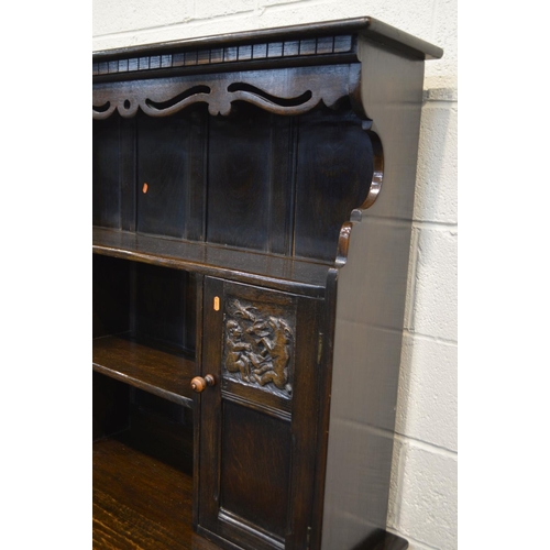 1296 - A MID TO LATE 20TH CENTURY OAK DRESSER with dental moulding and pierced apron under a fixed cornice,... 