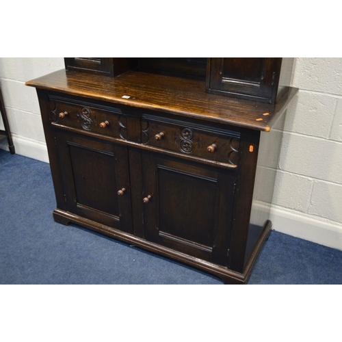 1296 - A MID TO LATE 20TH CENTURY OAK DRESSER with dental moulding and pierced apron under a fixed cornice,... 