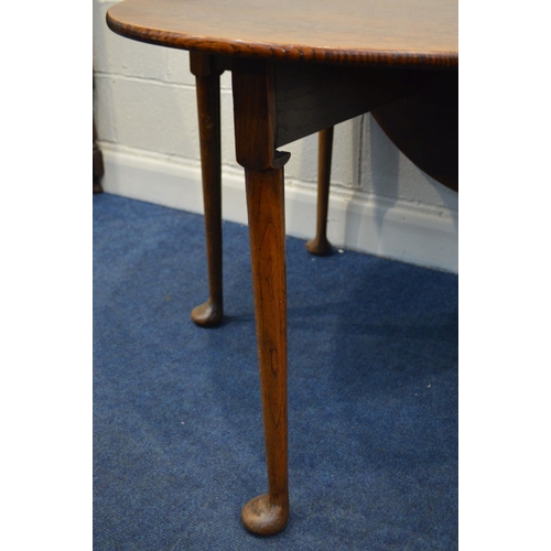 1298 - AN EARLY TO MID CENTURY OAK OVAL GATE LEG TABLE, on pad feet open width 150cm x closed width 60cm x ... 