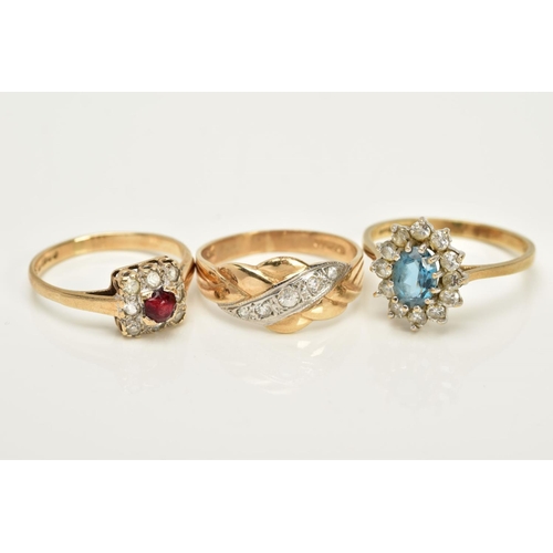 13 - THREE 9CT GOLD GEM SET RINGS, to include a squared designed cluster ring set with a circular cut red... 