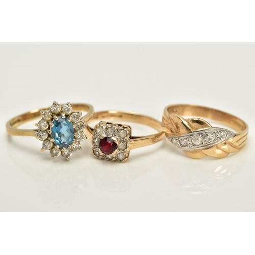 13 - THREE 9CT GOLD GEM SET RINGS, to include a squared designed cluster ring set with a circular cut red... 