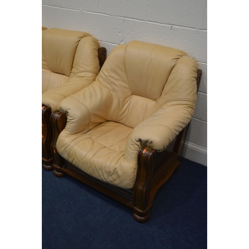 1300 - A MUSTARD LEATHER AND OAK FRAMED THREE PIECE LOUNGE SUITE, comprising a three seater settee and a pa... 