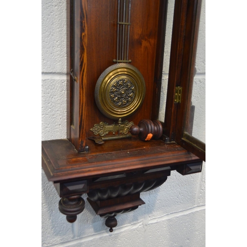 1304 - A LATE 19TH /EARLY 20TH CENTURY WALNUT VIENNA WALL CLOCK, the brass dial with Arabic numerals, heigh... 