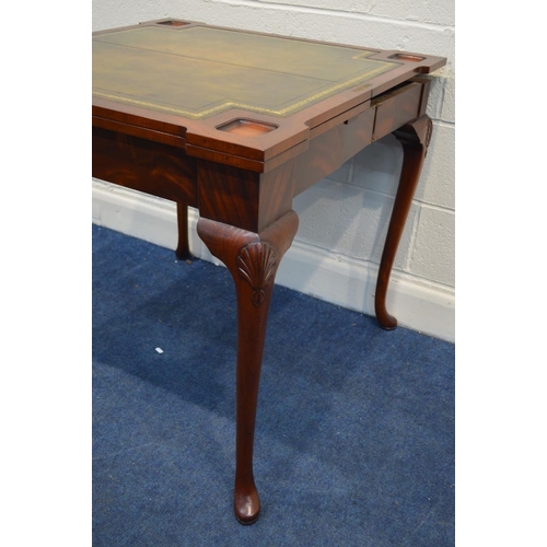 1313 - A REPRODUCTION MAHOGANY CONCERNTINA CARD TABLE, double fold over top enclosing an olive green leathe... 