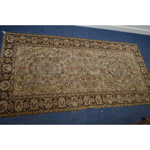 1355 - A KAYSERI FINE WOOL RUG, of a russet, cream and black ground, 292cm x 148cm (sd and worn fraying edg... 