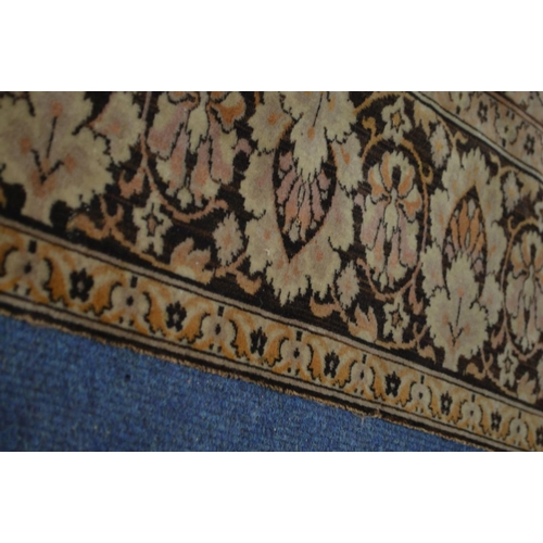 1355 - A KAYSERI FINE WOOL RUG, of a russet, cream and black ground, 292cm x 148cm (sd and worn fraying edg... 