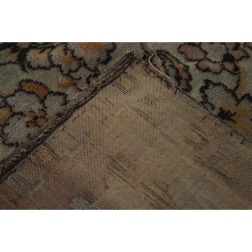 1355 - A KAYSERI FINE WOOL RUG, of a russet, cream and black ground, 292cm x 148cm (sd and worn fraying edg... 