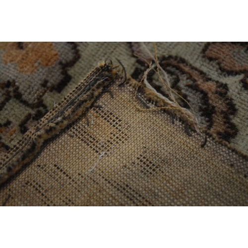 1355 - A KAYSERI FINE WOOL RUG, of a russet, cream and black ground, 292cm x 148cm (sd and worn fraying edg... 