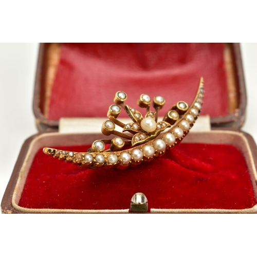 15 - A YELLOW METAL CULTURED PEARL CRESCENT BROOCH, the crescent set with a row of  graduated split pearl... 