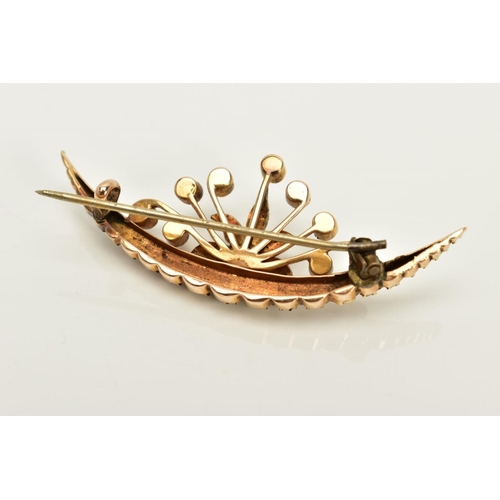 15 - A YELLOW METAL CULTURED PEARL CRESCENT BROOCH, the crescent set with a row of  graduated split pearl... 