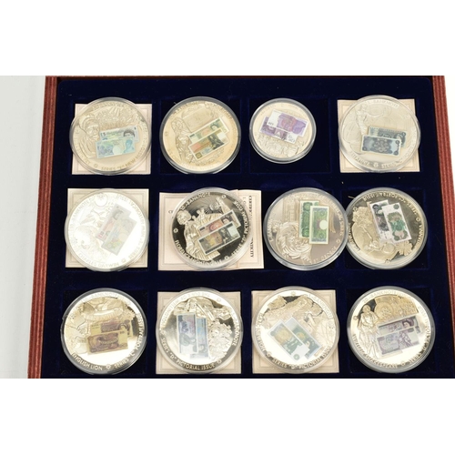 158 - A BOXED TWELVE SET OF WINDSOR MINT BRITISH BANKNOTE COMMEMORATIAVE COIN COLLECTION, housed in a wood... 