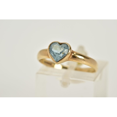 22 - A 9CT GOLD TOPAZ RING, designed with a heart cut blue topaz within a collet mount, plain polished ba... 