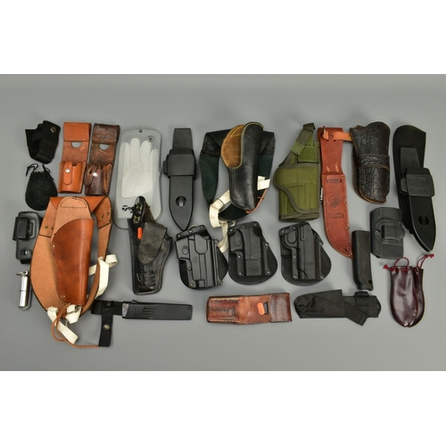 257 - A COLLECTION OF HOLSTERS AND LEATHER ITEMS comprising of two unnamed leather shoulder holsters, thre... 