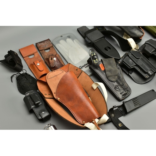 257 - A COLLECTION OF HOLSTERS AND LEATHER ITEMS comprising of two unnamed leather shoulder holsters, thre... 