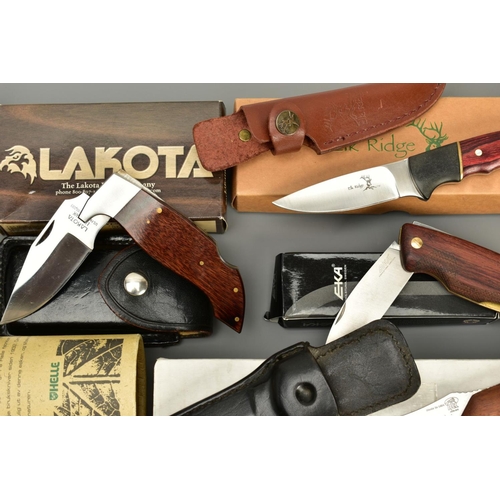 282 - A COLLECTION OF BOXED KNIVES consisting of Smith & Wesson lock knife in sheath, an American Lynxlite... 