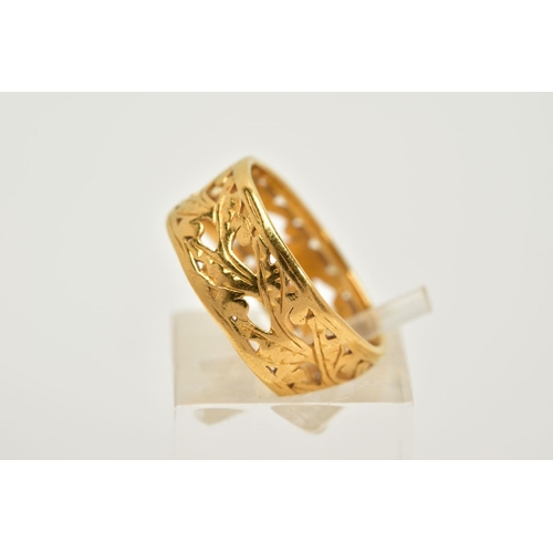 33 - A MID 20TH CENTURY 22CT GOLD ORNATE PIERCED BAND RING, flat section measuring approximately 7.5mm in... 