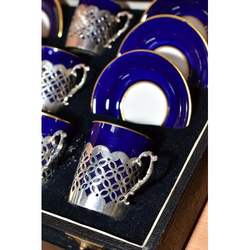 369 - A CASED SET OF SIX EARLY 20TH CENTURY AYNSLEY COFFEE CANS IN SILVER SLEEVES AND SAUCERS, blue and gi... 