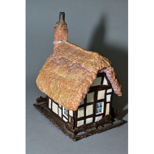 378 - AN ALBANY BONE CHINA AND BRONZE 'WORCESTERSHIRE COTTAGE', modelled by Caroline Parker, stamped to ba... 