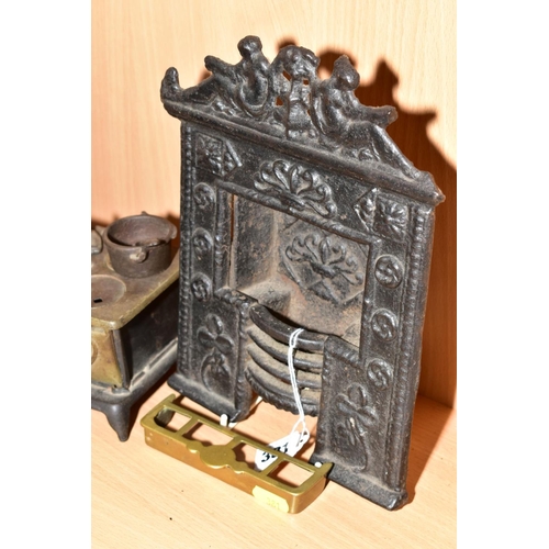 381 - A VICTORIAN CAST IRON MINIATURE FIREPLACE WITH INTEGRAL FIRE BASKET, height 25cm, together with a mi... 