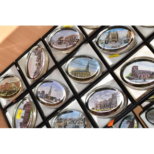 384 - A COLLECTION OF FORTY SEVEN BOXED OVAL GLASS PAPERWEIGHTS, each with a print to the base, mostly sce... 