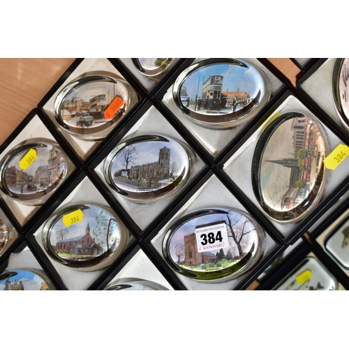 384 - A COLLECTION OF FORTY SEVEN BOXED OVAL GLASS PAPERWEIGHTS, each with a print to the base, mostly sce... 