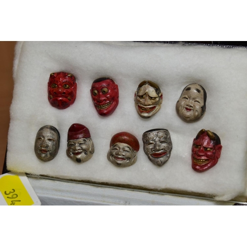 394 - NINE CARVED WOOD AND PAINTED MINATURE OF NOH MASKS, approximate height 2cm, together with a late 19t... 