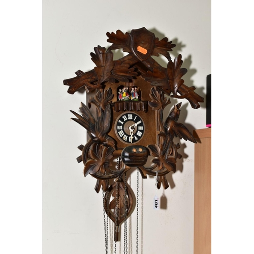 401 - A MID TWENTIETH CENTURY BLACK FOREST STYLE CUCKOO CLOCK, with matched pediment and pendulum, with da... 