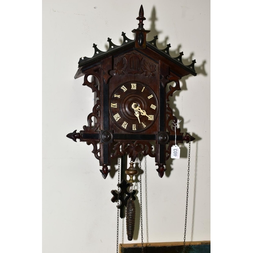 403 - AN EARLY TWENTIETH CENTURY BLACK FOREST STYLE CUCKOO CLOCK, pierced pediment and sides, wooden dial ... 