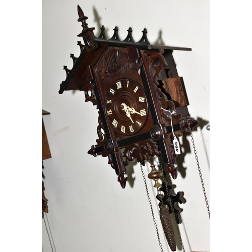 403 - AN EARLY TWENTIETH CENTURY BLACK FOREST STYLE CUCKOO CLOCK, pierced pediment and sides, wooden dial ... 